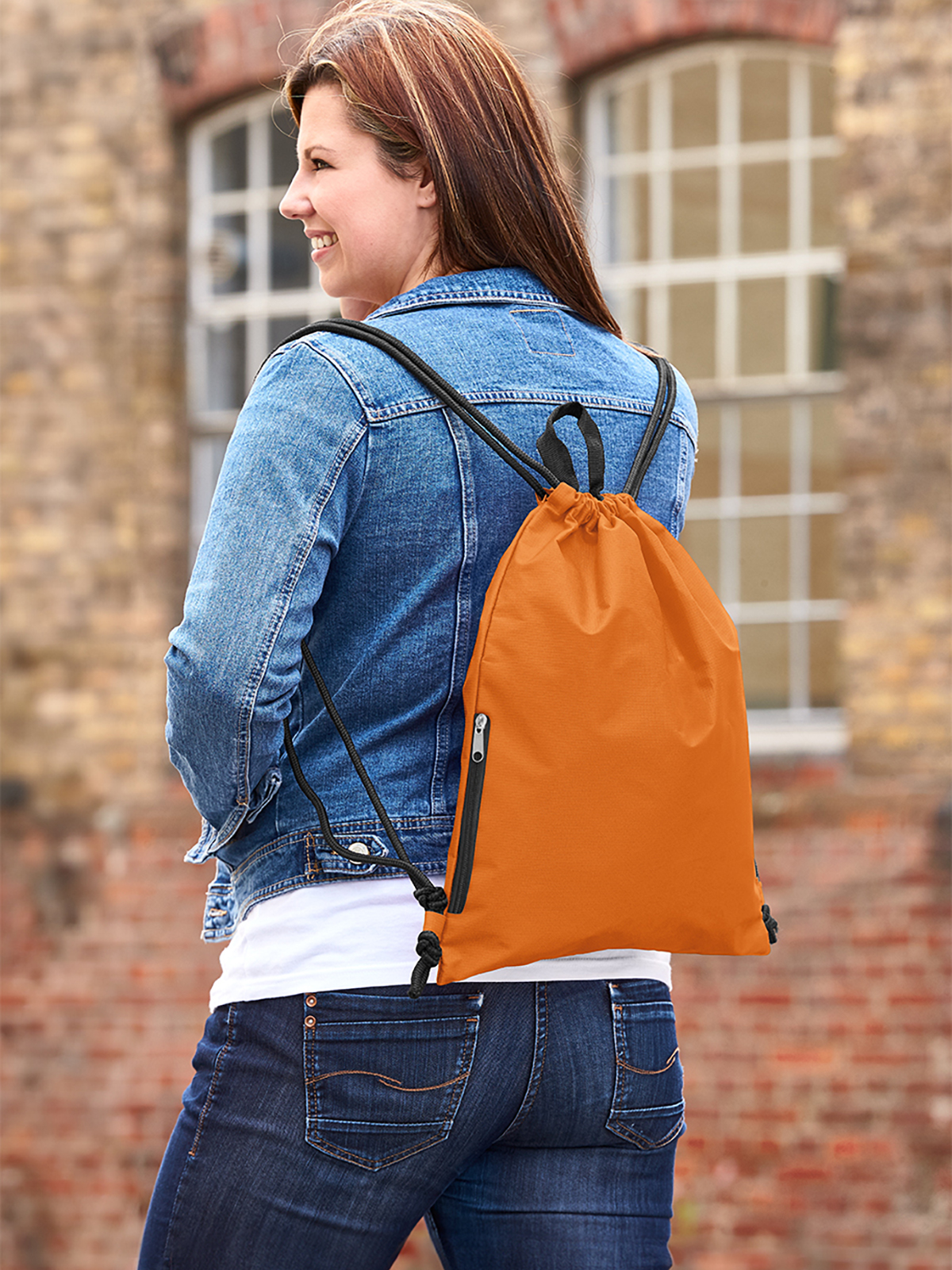 drawstring bag JOIN orange featuring a model