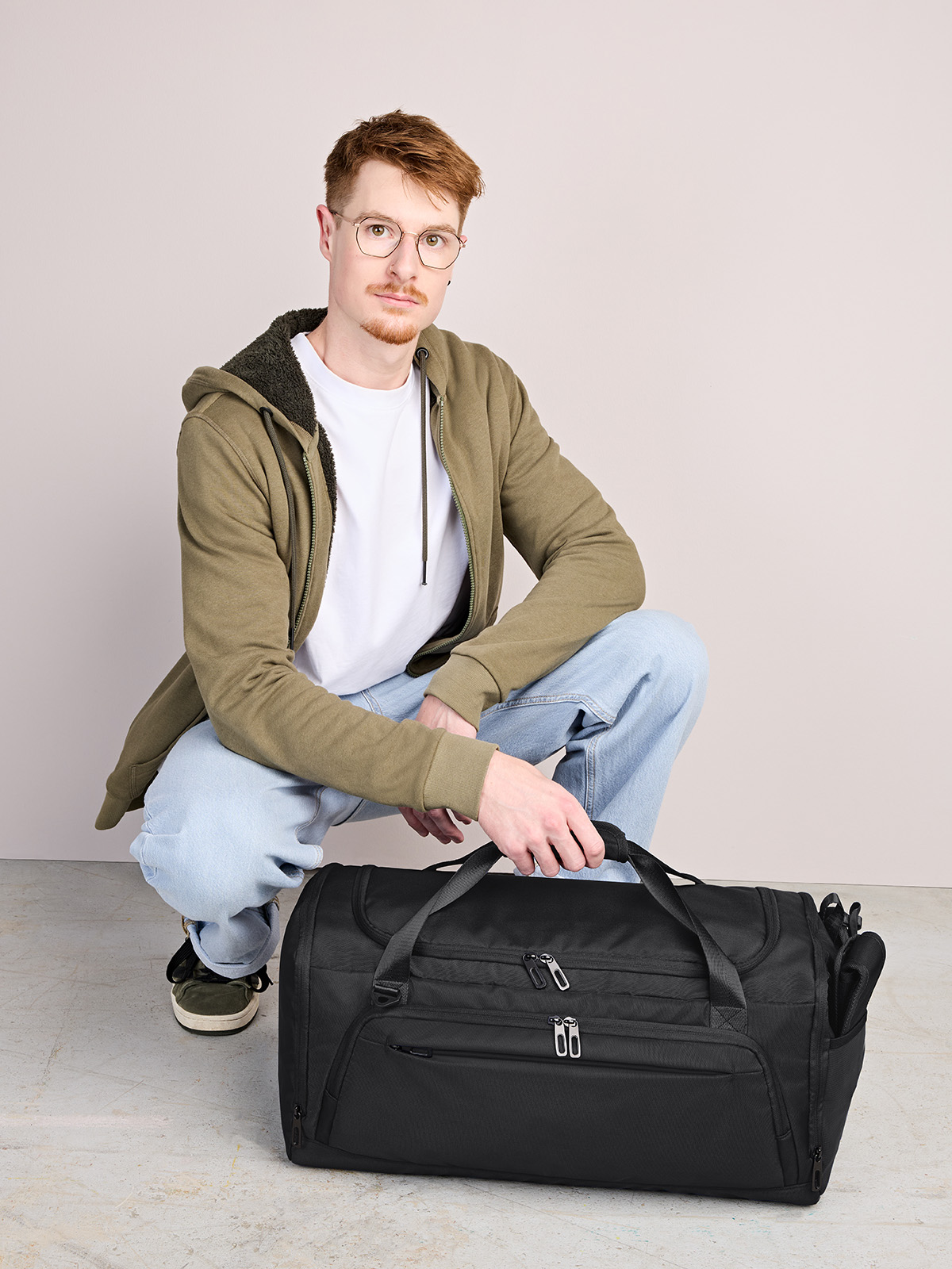 sport/travel bag SOLID black featuring a model