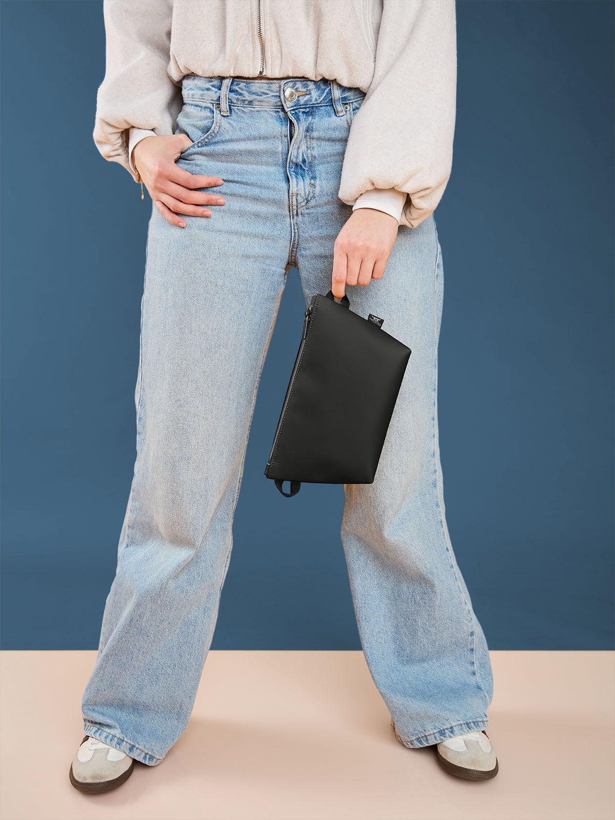 zipper bag PURE in black, shown with model