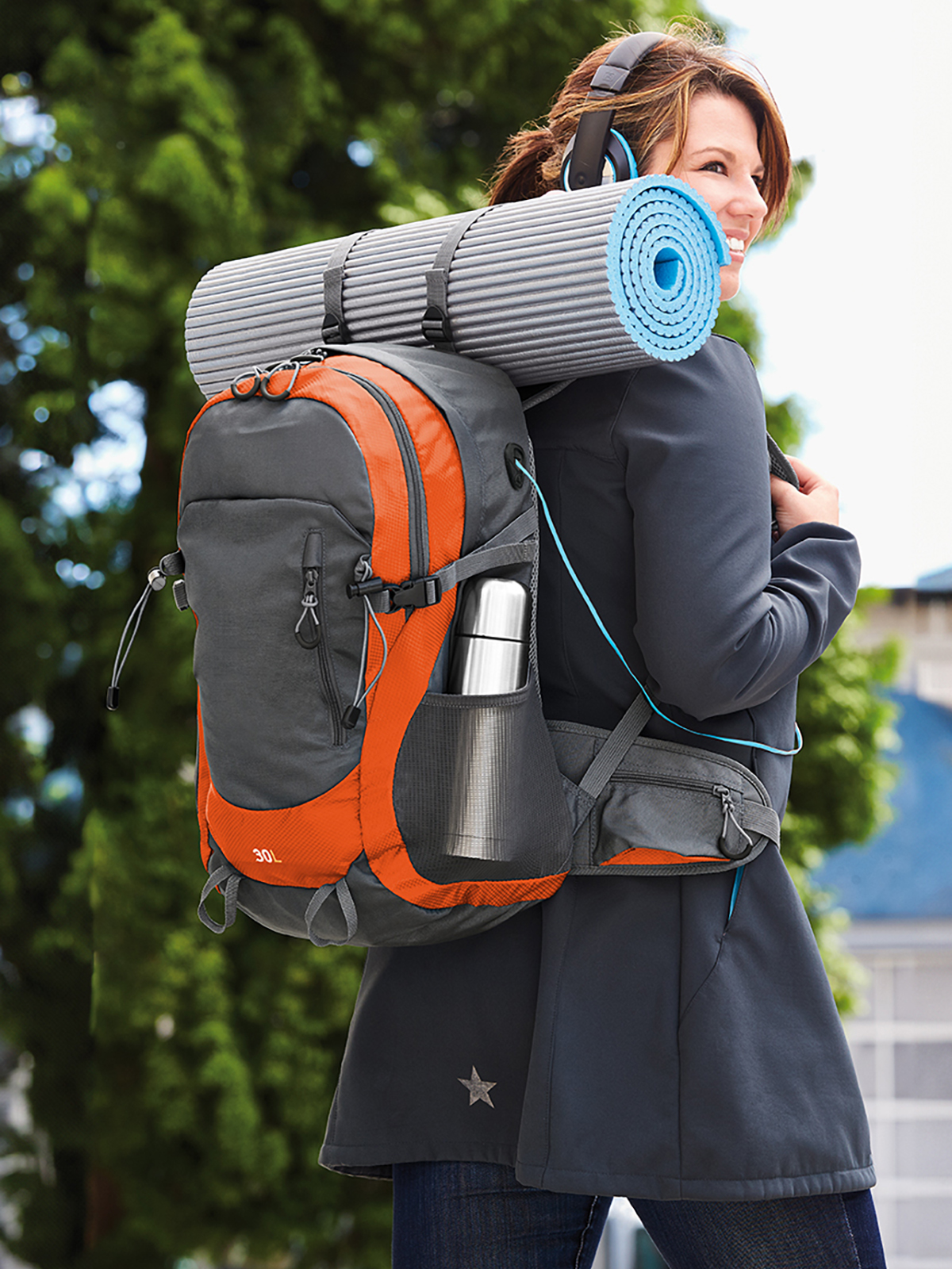 backpack TRAIL orange featuring a model