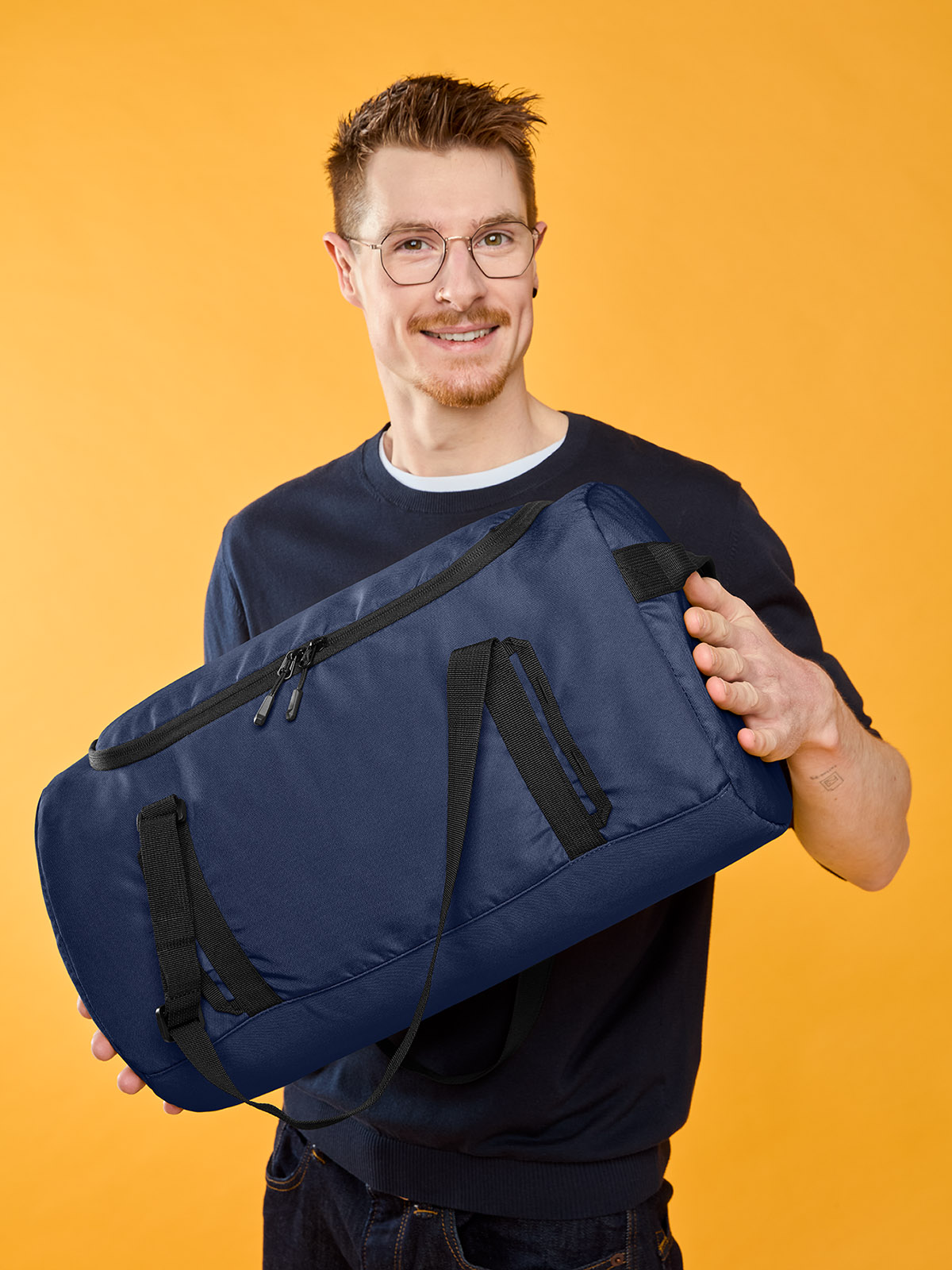 sport/travel bag LOOP in navy, shown with model