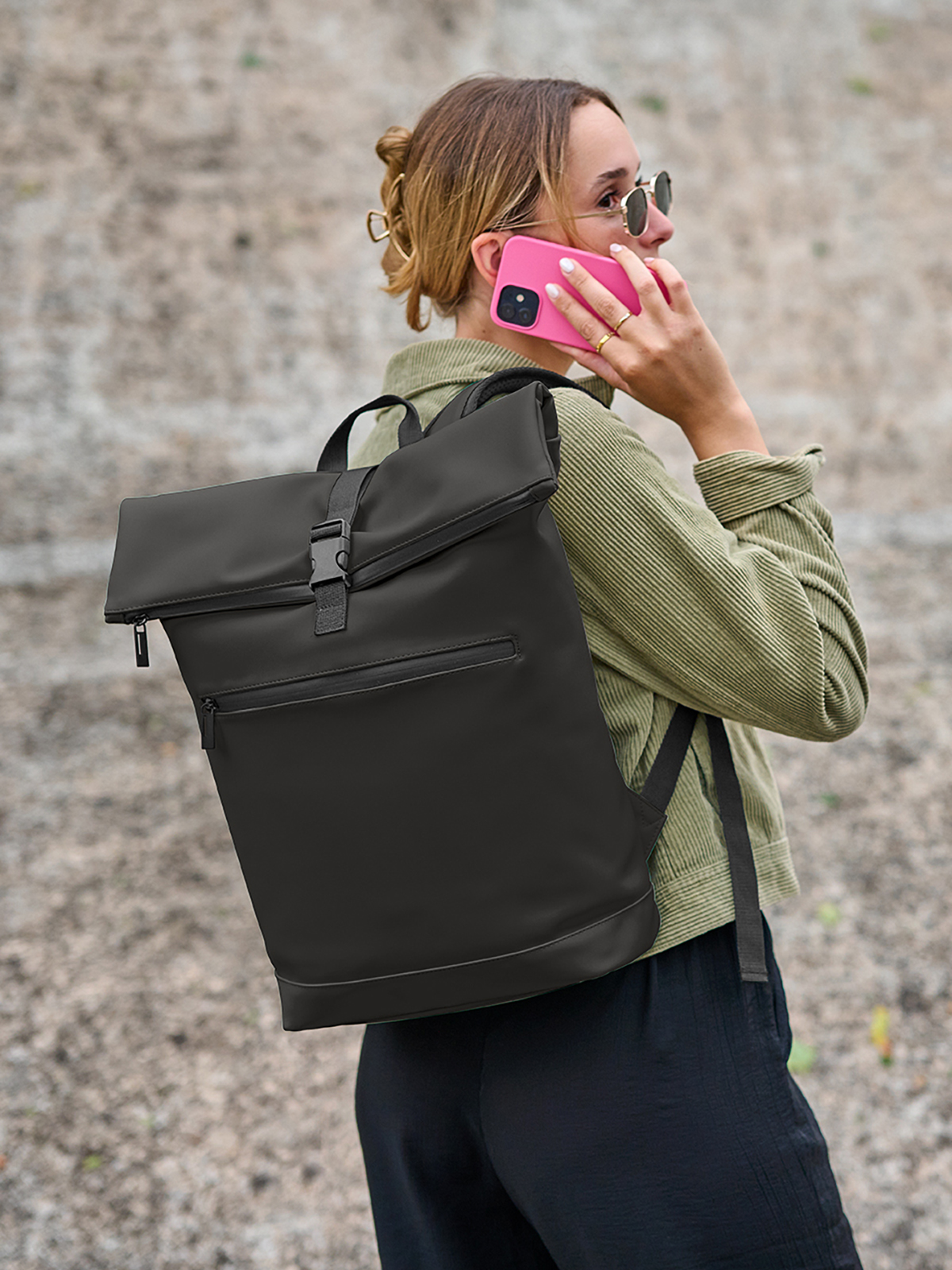 laptop backpack PURE black featuring a model