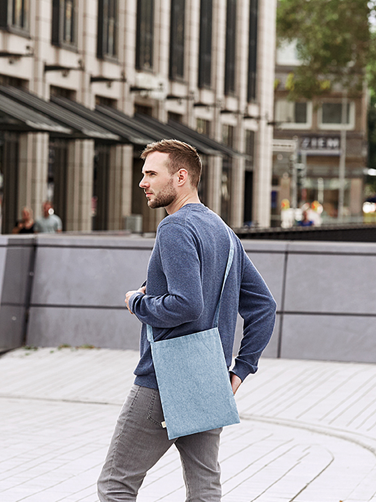 tote bag PLANET blue featuring a model