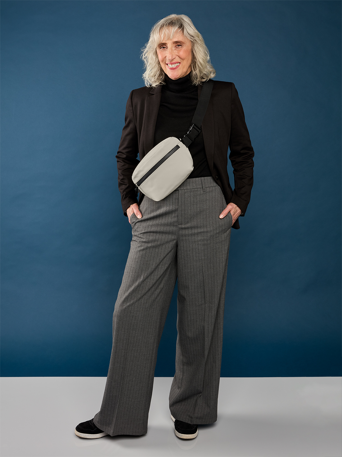 waist bag PURE in beige, shown with model