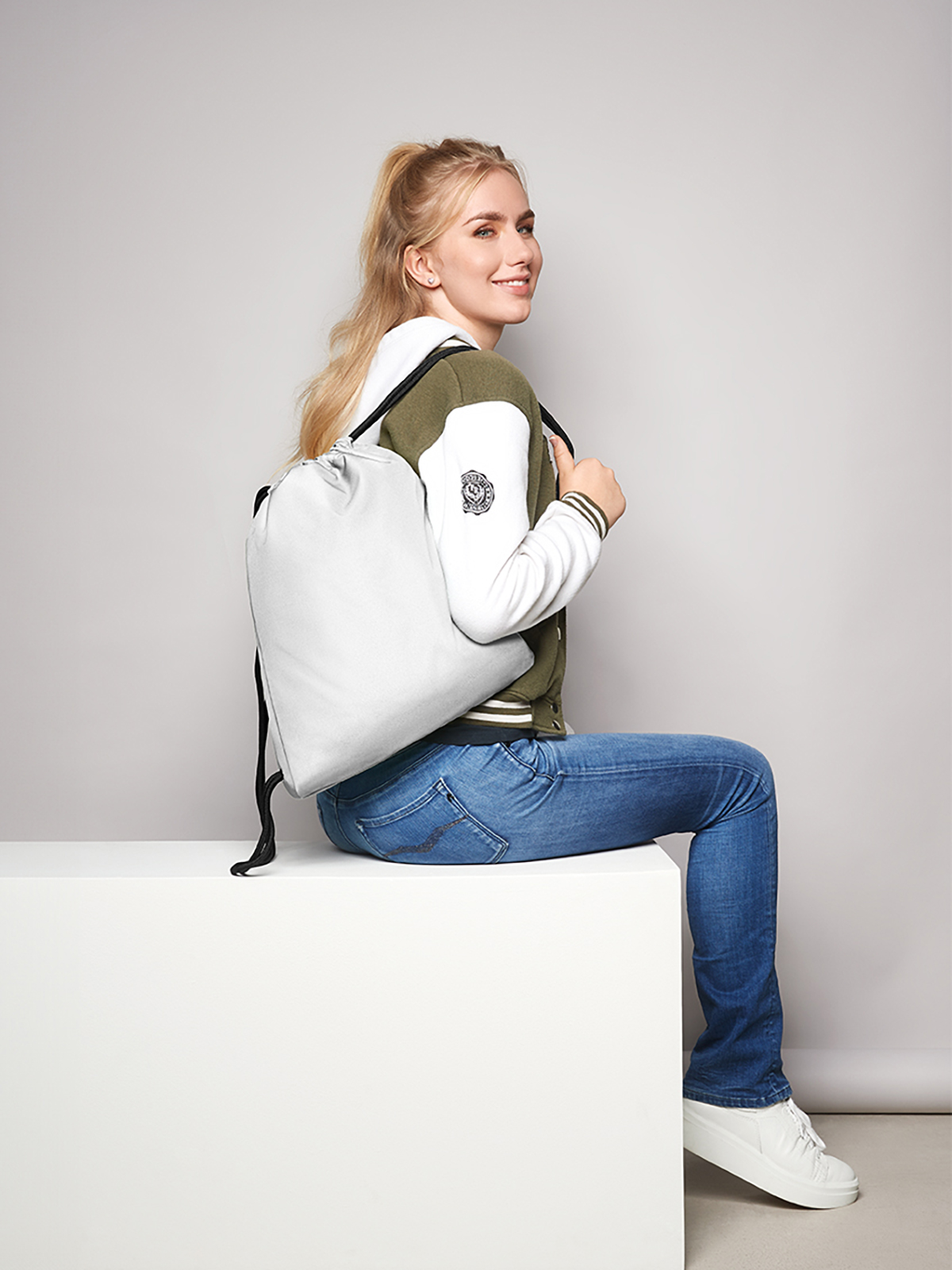 drawstring bag CARE white featuring a model