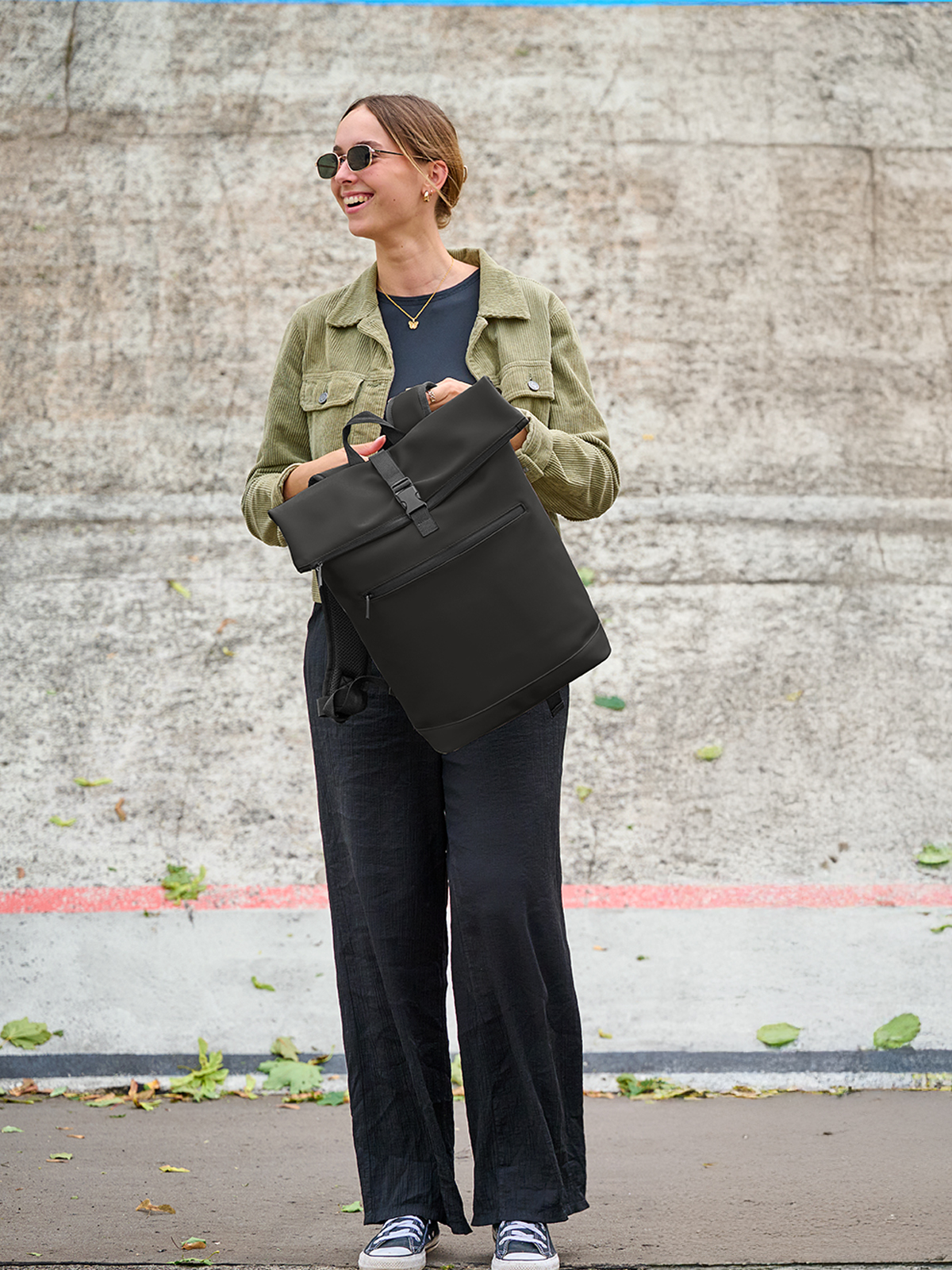 laptop backpack PURE black featuring a model