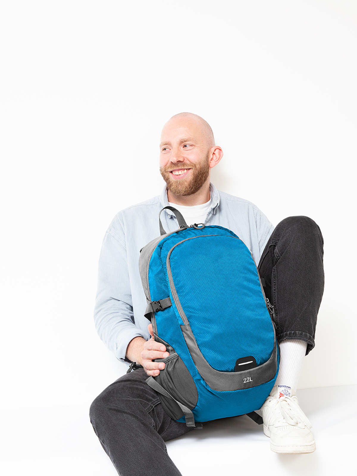 backpack STEP L cyan featuring a model