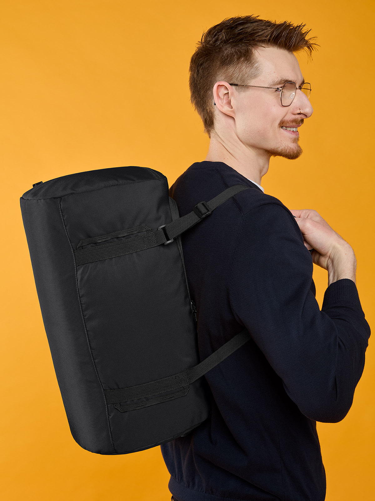 sport/travel bag LOOP in black, shown with model