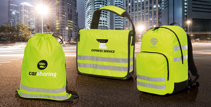Several bright yellow REFLEX bags with black details shown together.
