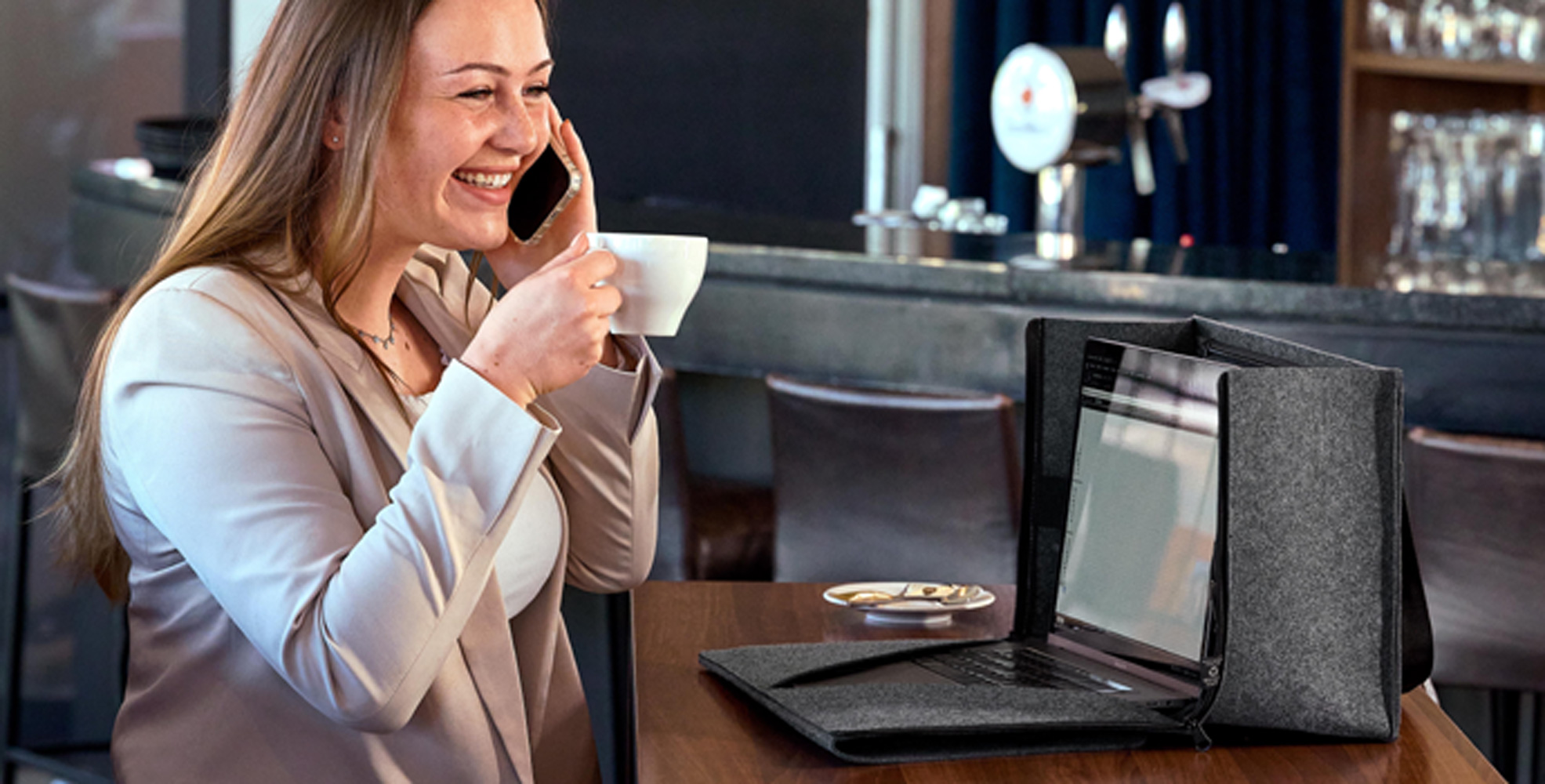 Laptop organizer as office to go in a café, person working on laptop