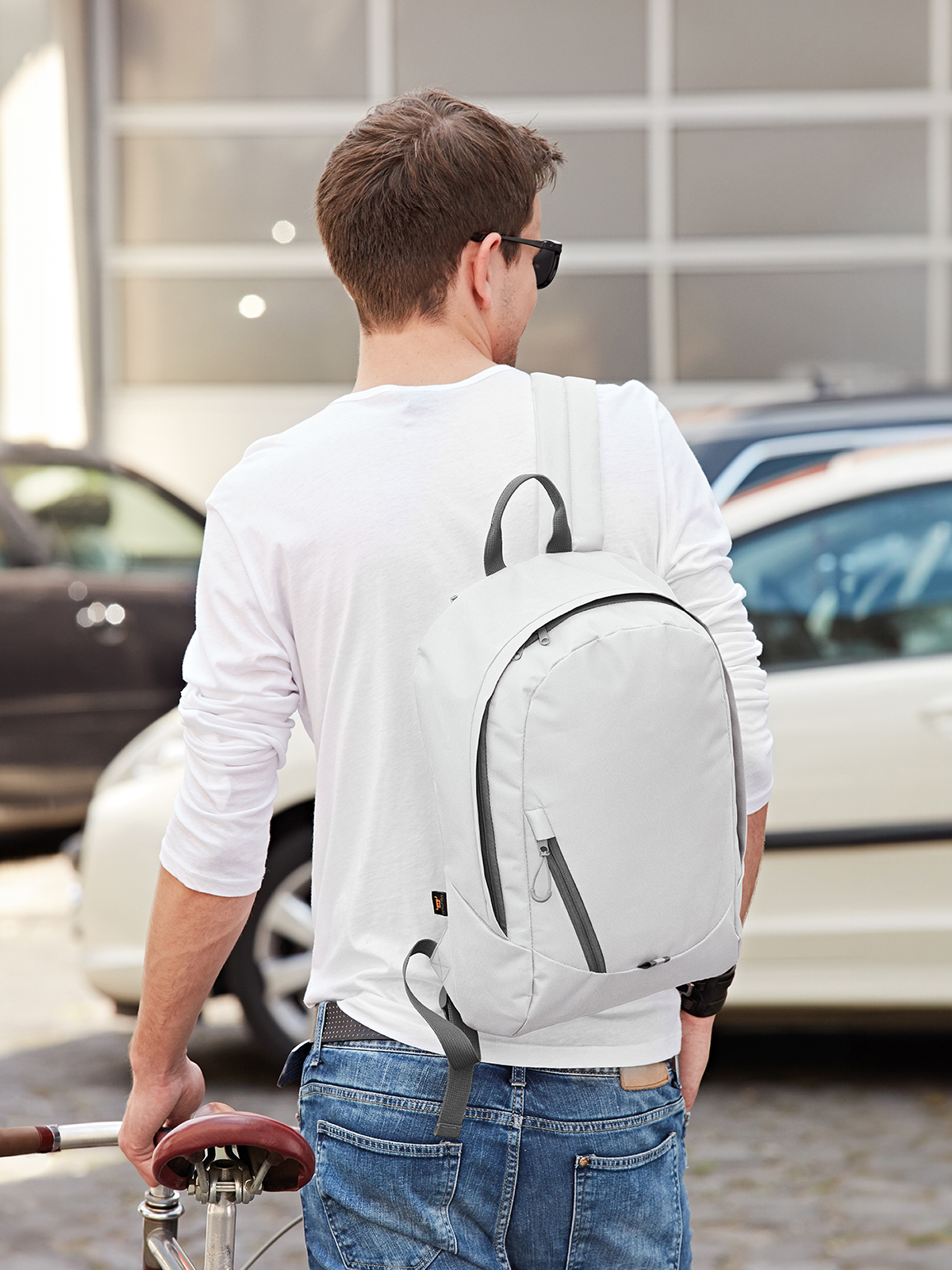 backpack SOLUTION white featuring a model