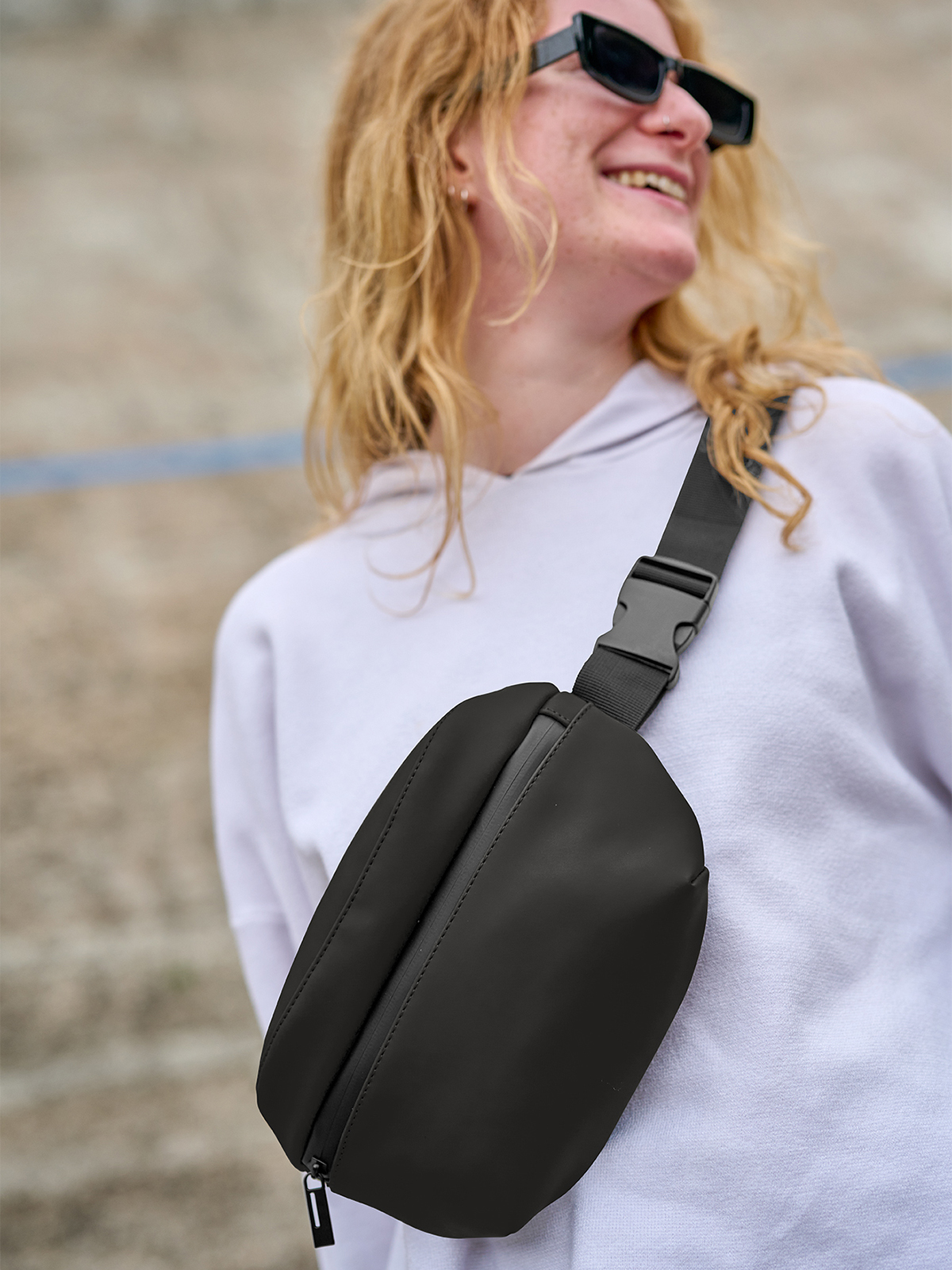 waist bag PURE black featuring a model