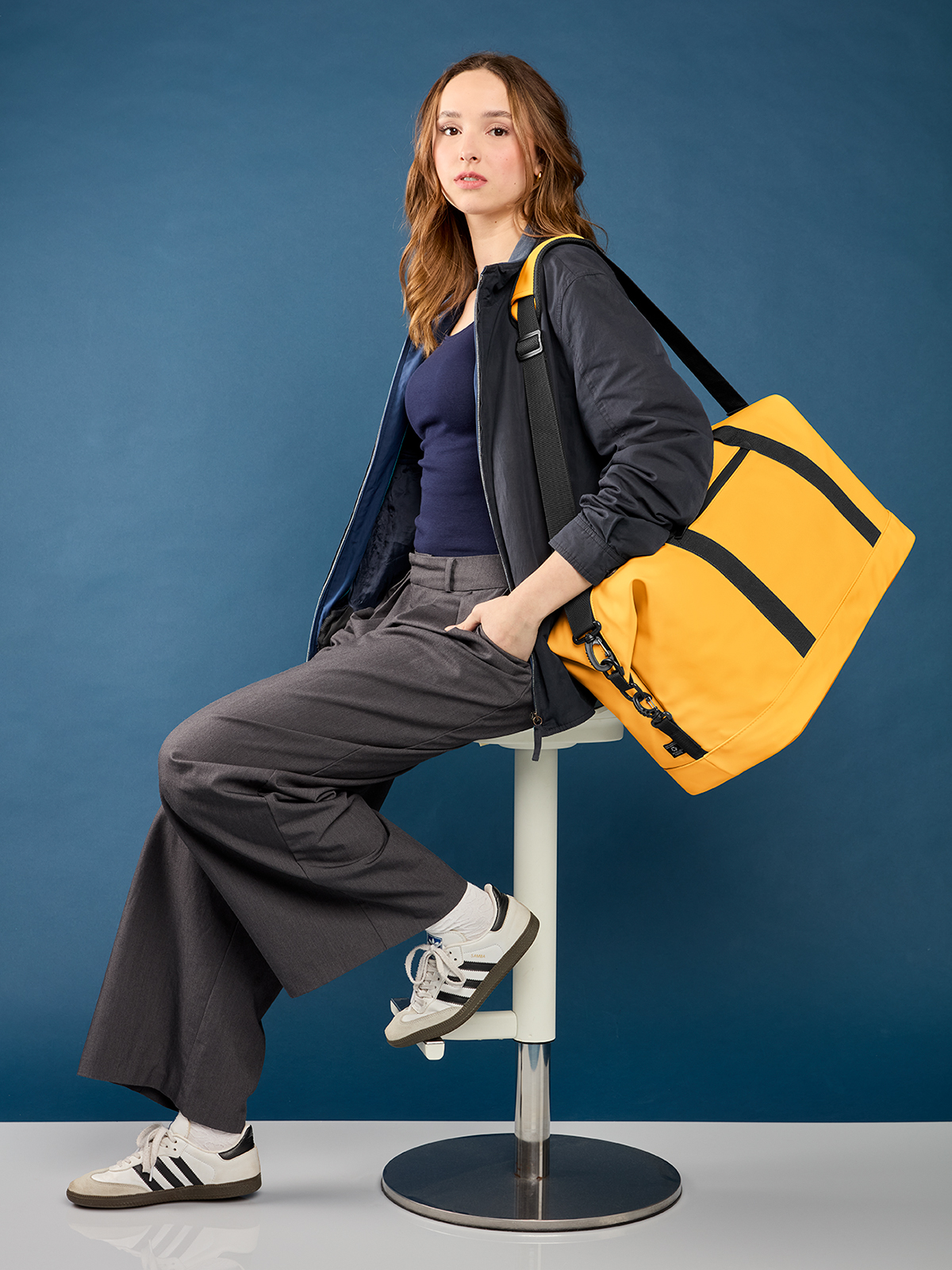 sport/travel bag PURE in yellow, shown with model