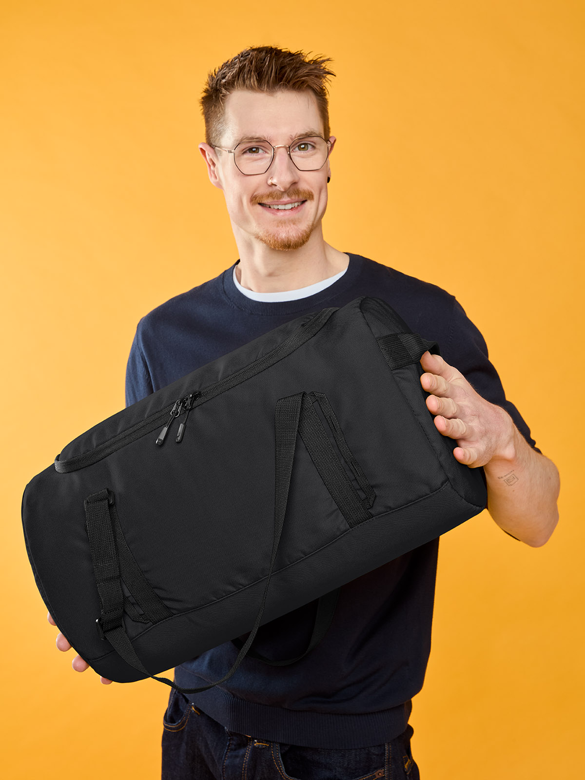 sport/travel bag LOOP in black, shown with model