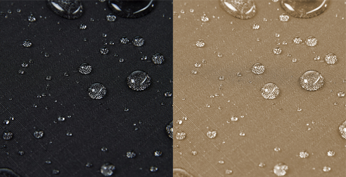 Wassertröpfchen auf dunklem und hellem Stoffmaterial