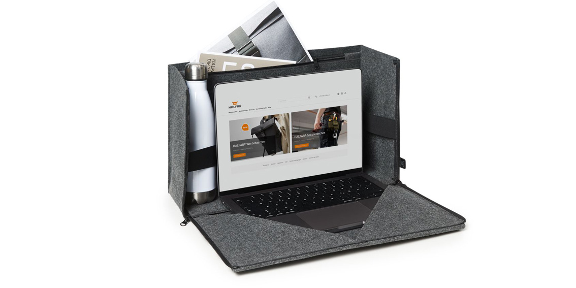 Laptop organizer as mobile workspace with laptop, bottle and documents