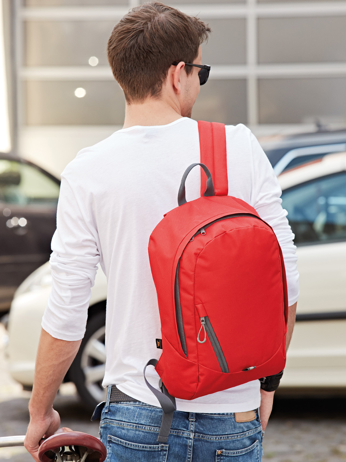 backpack SOLUTION red featuring a model