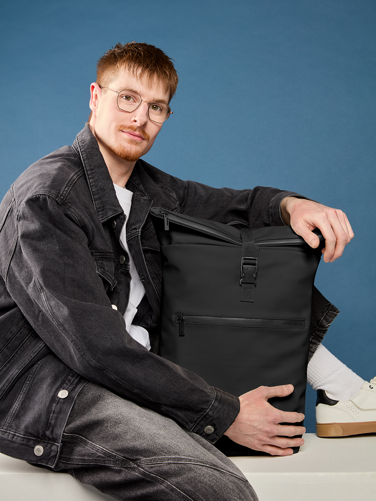 laptop backpack PURE in black, shown with model